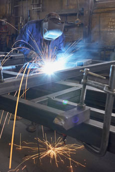 welder working on a metal frame