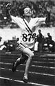 Betty Robinson reaching the finish line