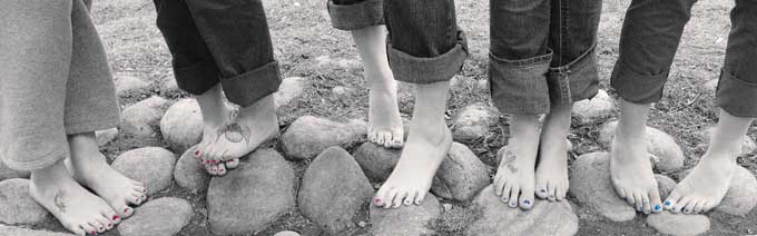 photo of bare feet with painted toenails.