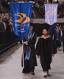 Dr. Khaleel leading a procession during commencement
