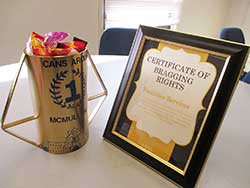 traveling trophy and certificate for Cans Around McMullen