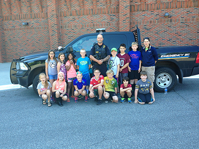 Kids at MSUB summer camp with University police officer