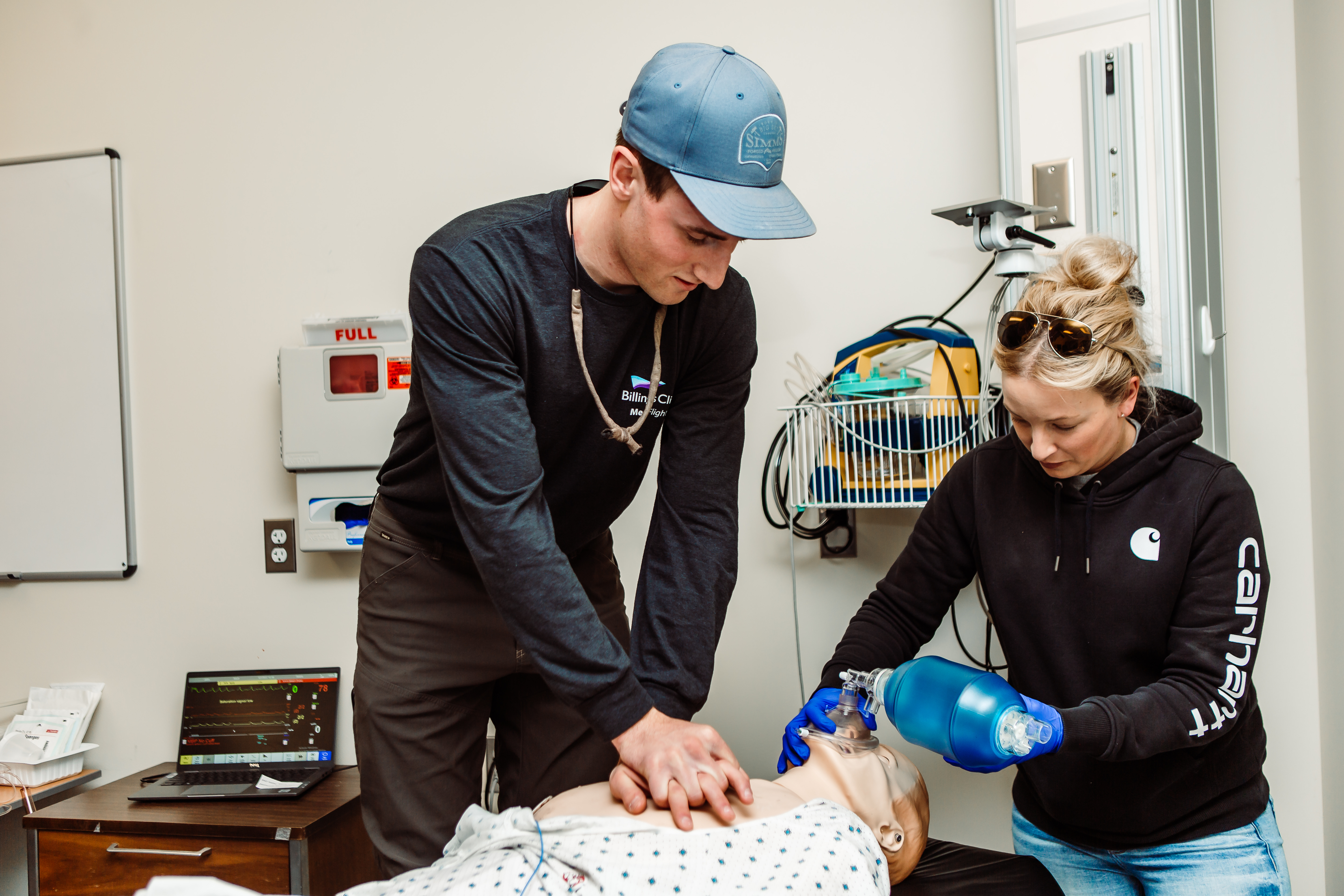 CNA students with a medical dummy