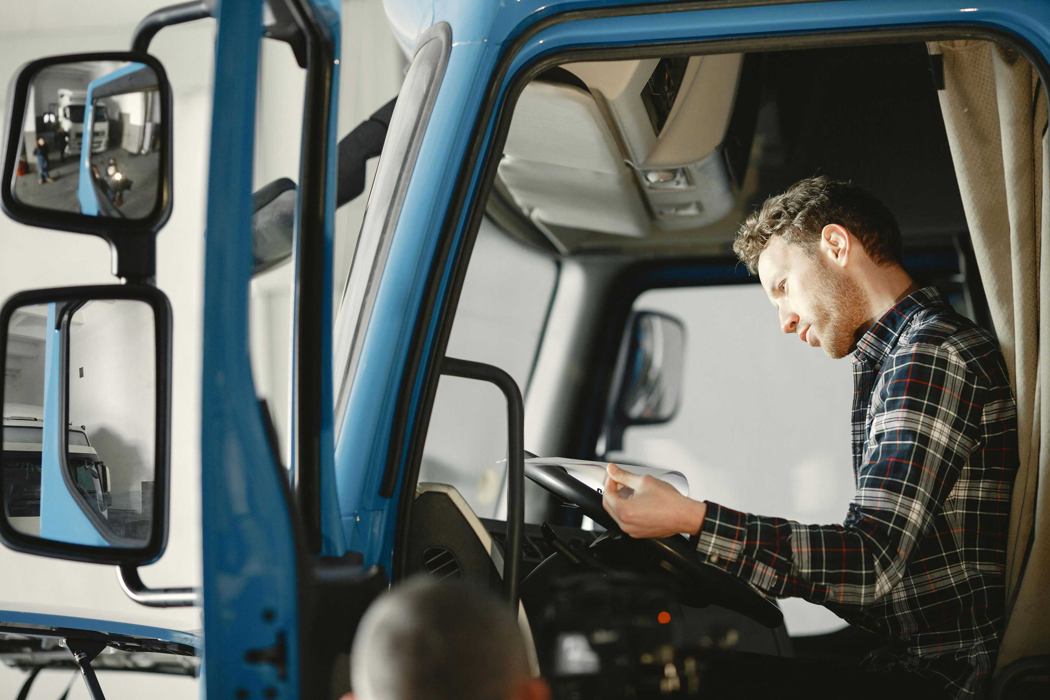 Man in truck reading