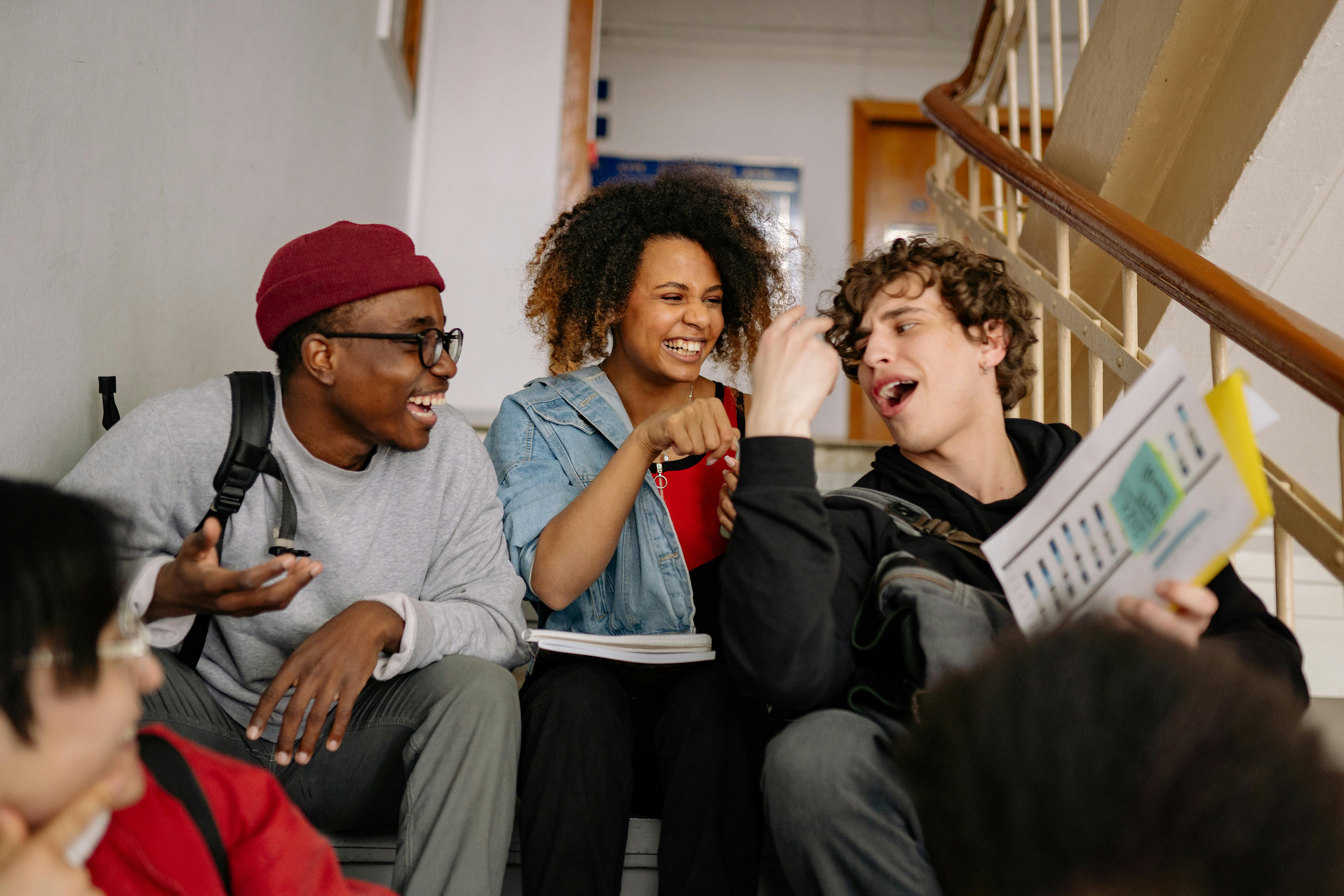 Main banner image Group of students laughing on stairs