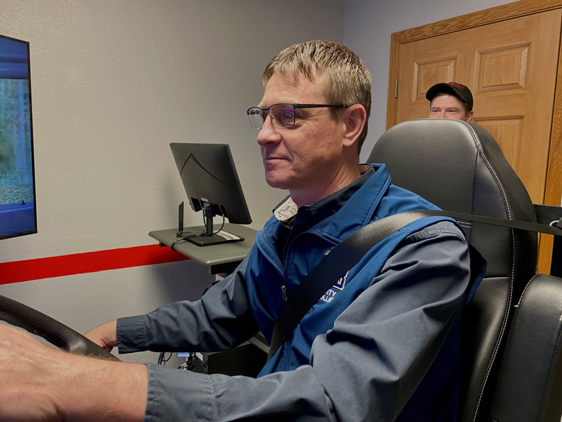 Man sitting in a vehicle simulator