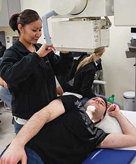 A Radiology Technologist students in the x-ray lab