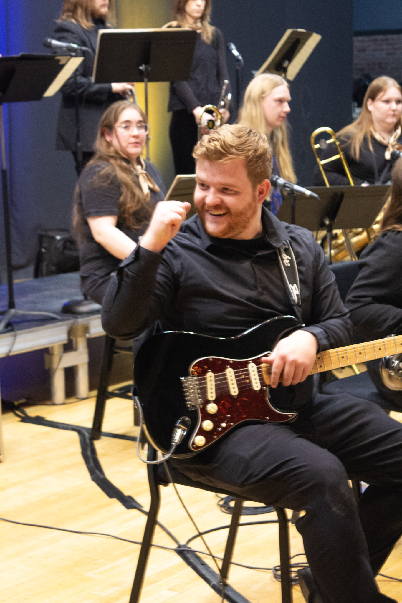 Jazz Orchestra guitarist smiling