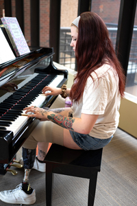 Alia Downer playing piano