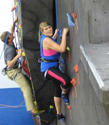 students having fun on the climbing wall at MSUB
