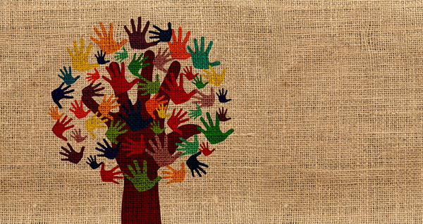 tree trunk with multicolored handprints as leaves pritned on burlap