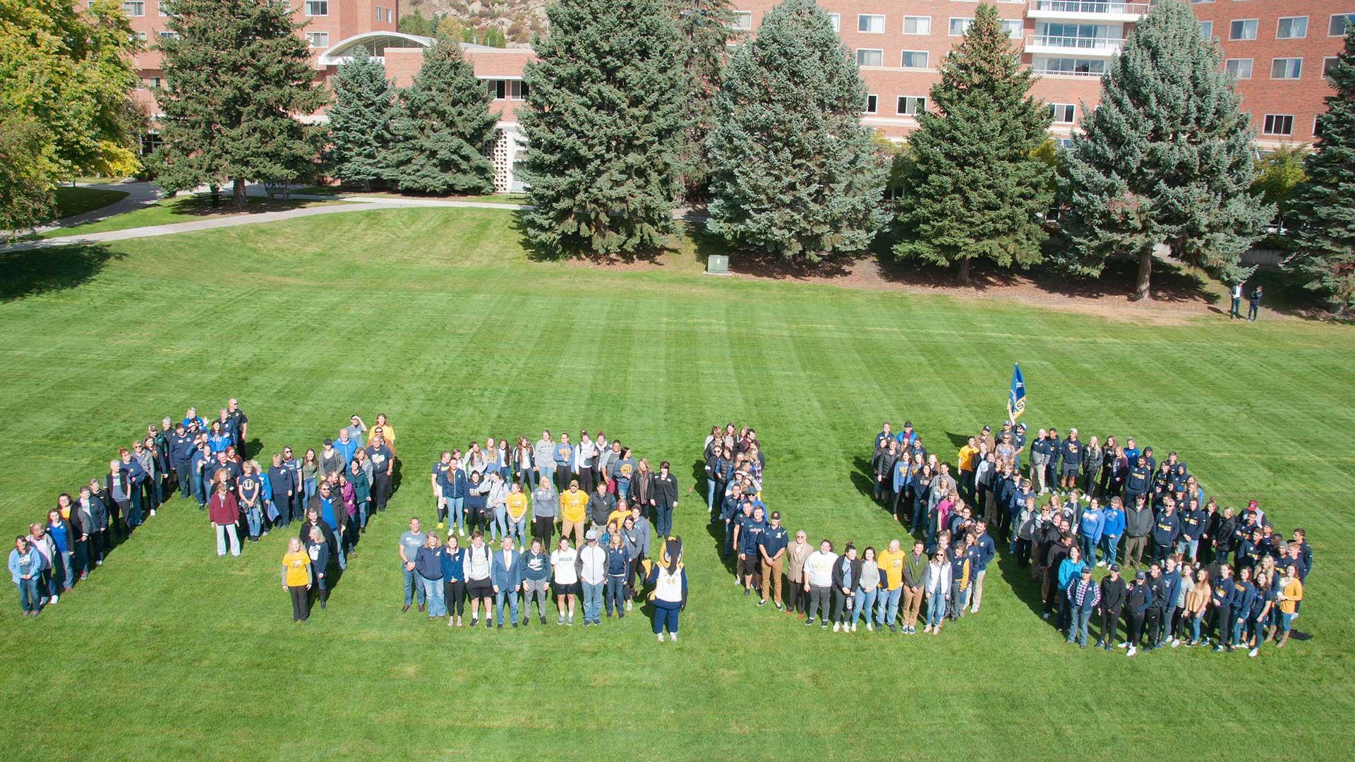 MSUB "swarm" - students, faculty, and staff spell out MSUB on the lawn
