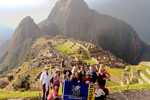 Students pose near Machu Picchu
