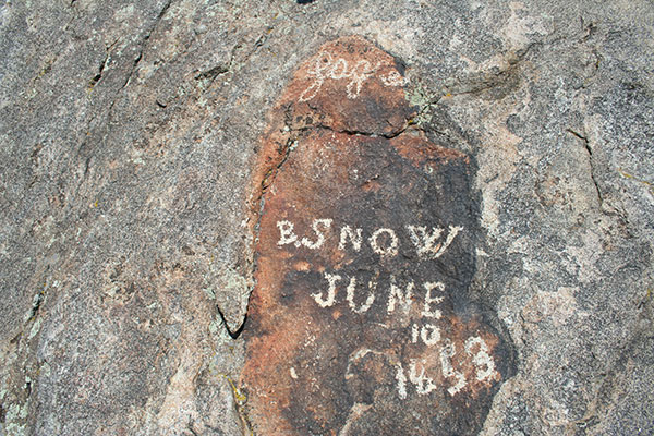 signature and date on a rock from the 1800x