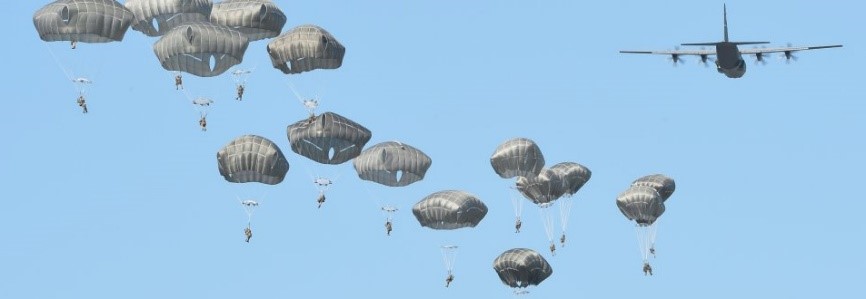 paratroopers jumping from an aircraft