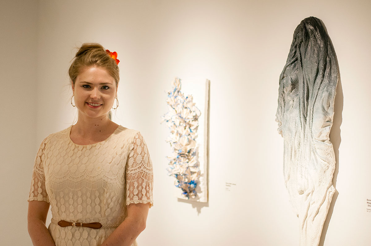 Bonny Beth with her art in Northcutt Steele Gallery