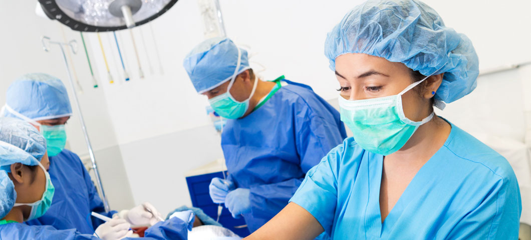 Doctors and nurses performing surgery.