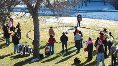 MSUB students, faculty and staff gather around the medicine wheel constructed on the main campus