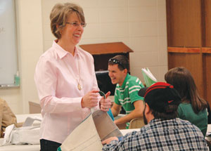 Dr. Agnes Samples works with current students in a health promotion class at MSU Billings