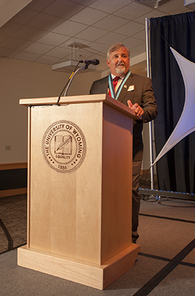 Dr. Ken Miller at the podium